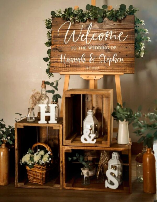 rustic boho style wooden crate display with welcome sign for weddings