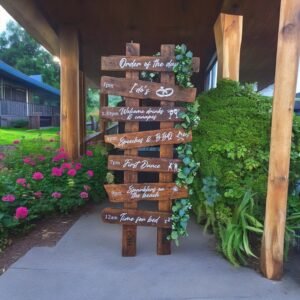dark wooden rustic wedding order of the day sign